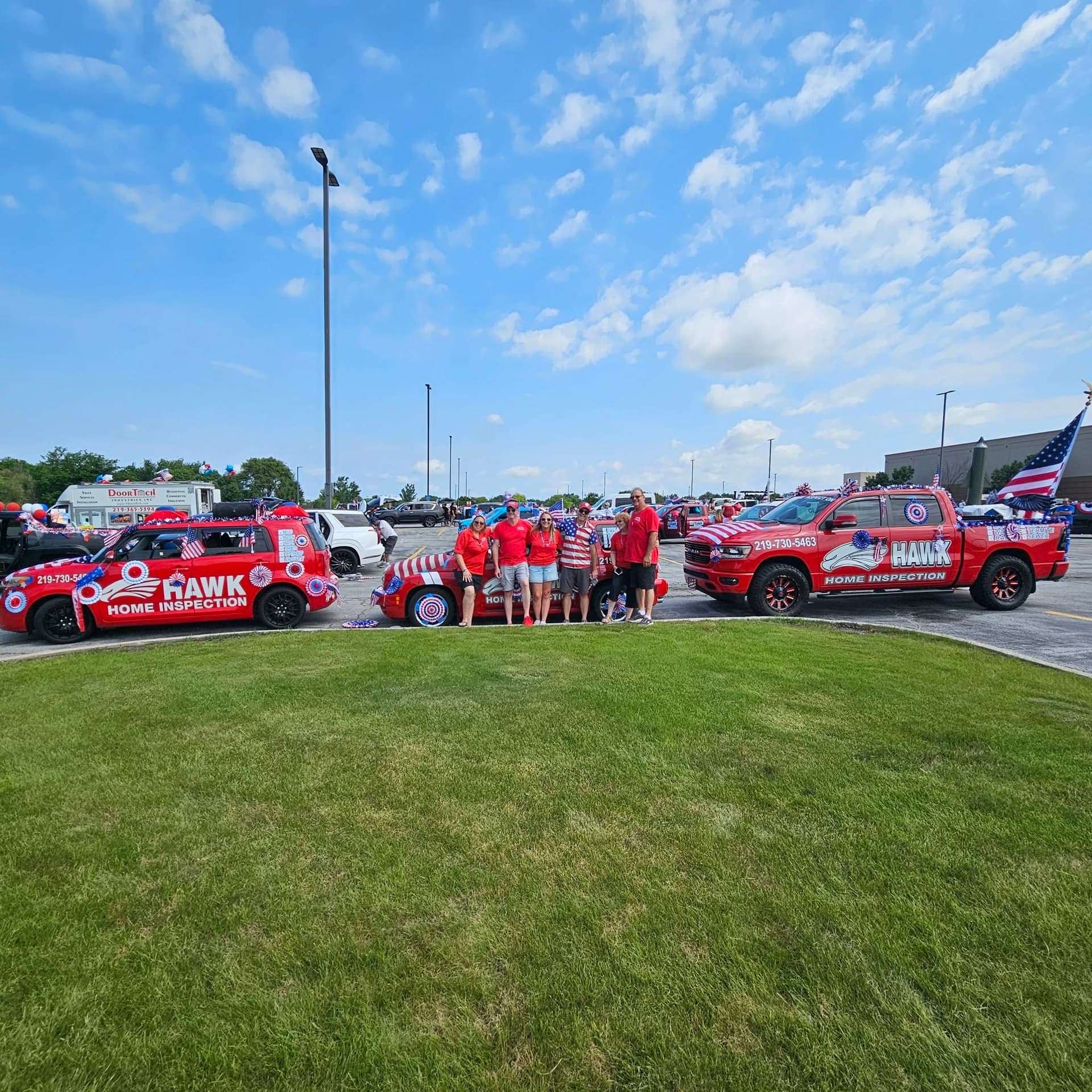 Hawk Home Inspection team with branded fleet vehicles at community event — Northwest Indiana